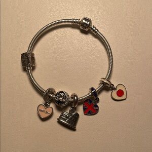 Pandora Silver Charm Bracelet (travel themed, flower clips have sold separately)